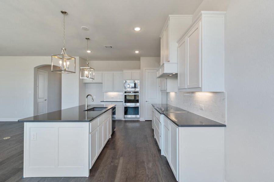 Kitchen | Concept 2406 at Hidden Creek Estates in Van Alstyne, TX by Landsea Homes