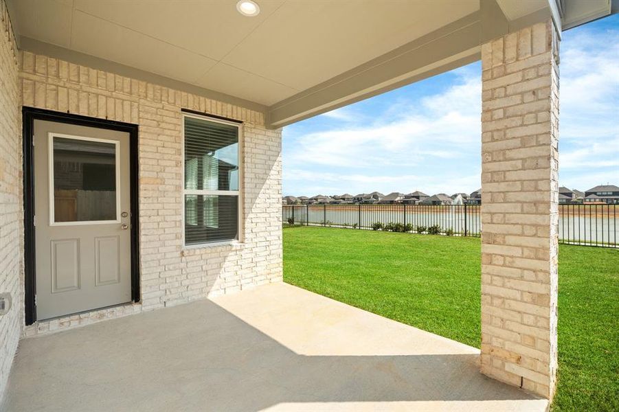 Backyard retreat, offering an abundance of space for kids to play and explore. The possibilities are endless in this outdoor haven, where the joy of open-air activities and family gatherings awaits. Sample photo of completed home with similar floor plan.