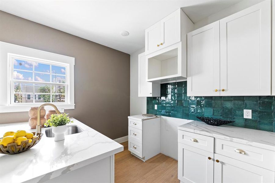 Full kitchen with designated space for your microwave, and range/stove combo.