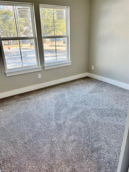 Unfurnished room featuring carpet flooring