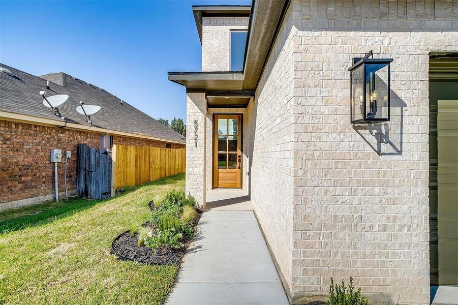 The 8 foot entry door is a statement piece as you walk up.