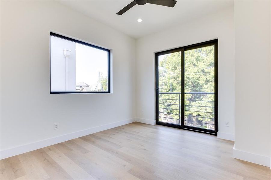 Spare room featuring light wood-type flooring and ceiling fan