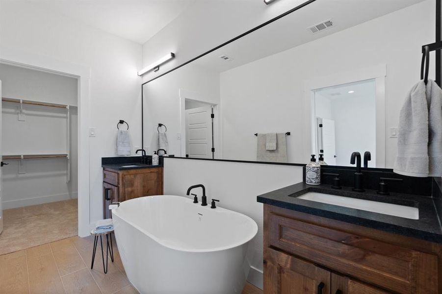 Double vanities, large soaking tub & walk-in closet in Primary Bath