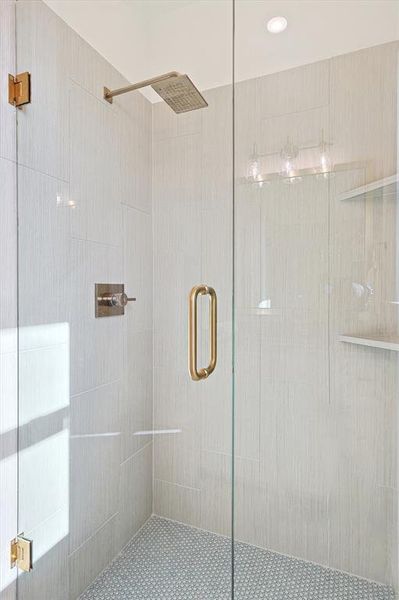 Bathroom featuring a shower with shower door