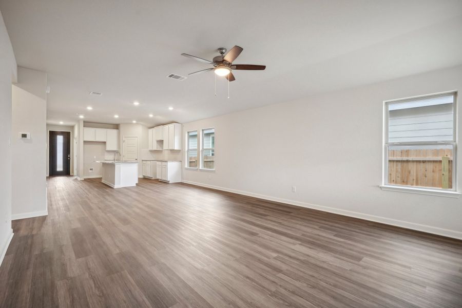 Living room, dining room, and kitchen in the Allen floorplan at a Meritage Homes community.