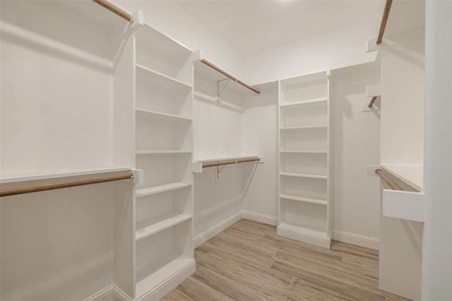 Walk in closet featuring light hardwood / wood-style floors