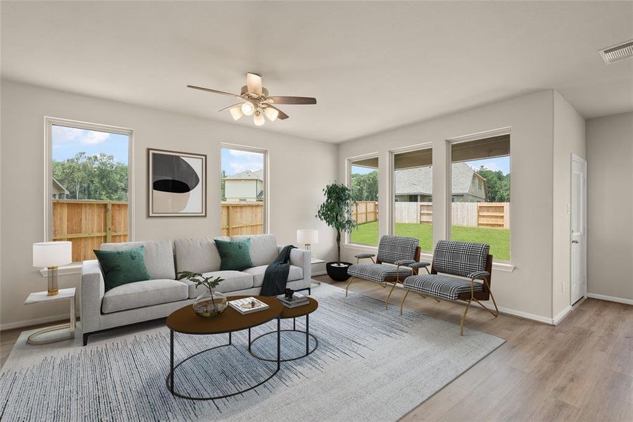 Your family room has ample space to entertain family and friends. This space features beautiful floors, fresh paint, ceiling fan with lighting, and high ceilings.