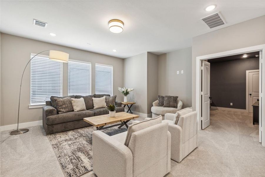 Living room featuring light colored carpet