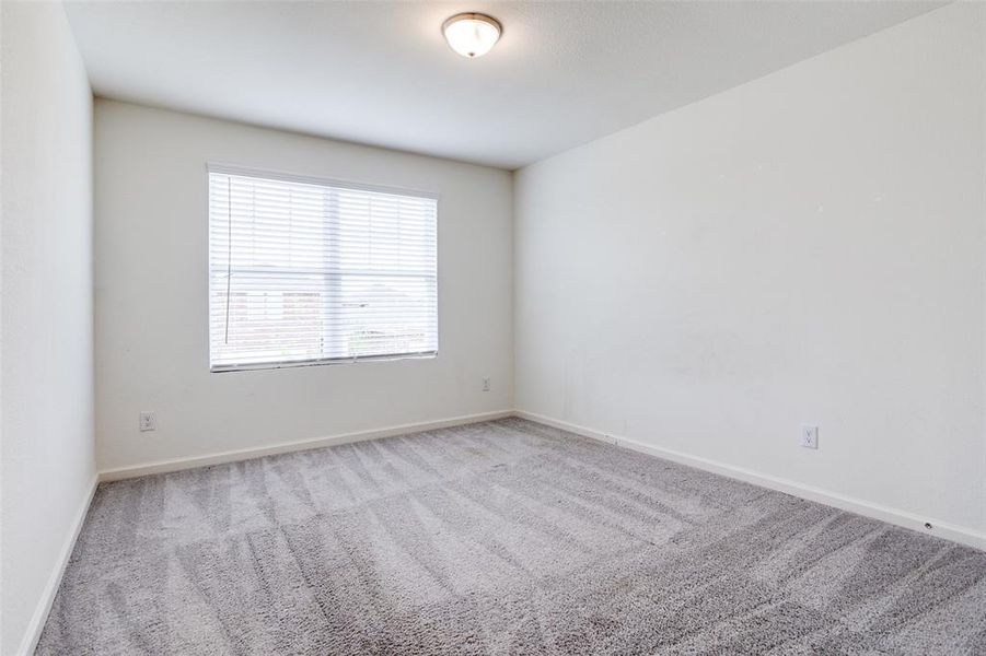 Spare room featuring carpet floors