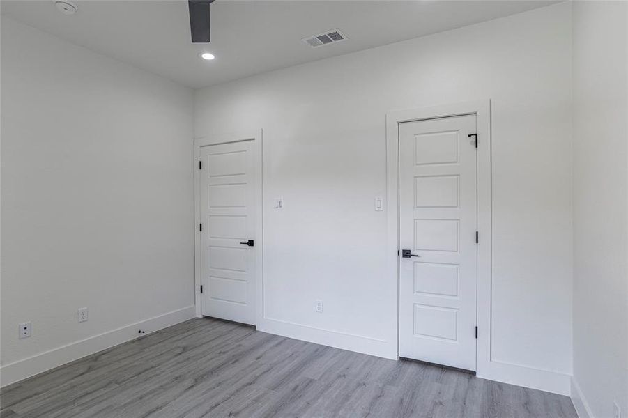 Unfurnished bedroom featuring light hardwood / wood-style floors