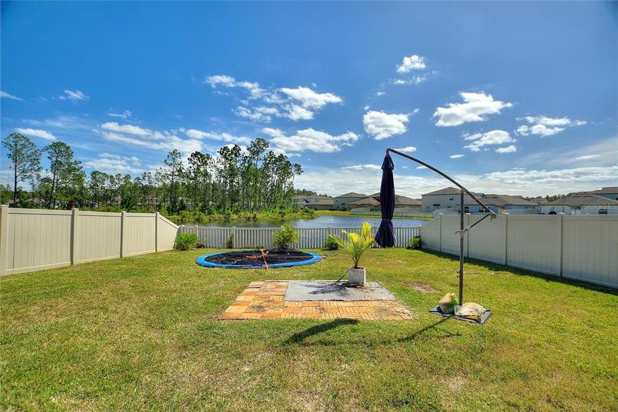 Back yard view of the pond from sliding glass doors.