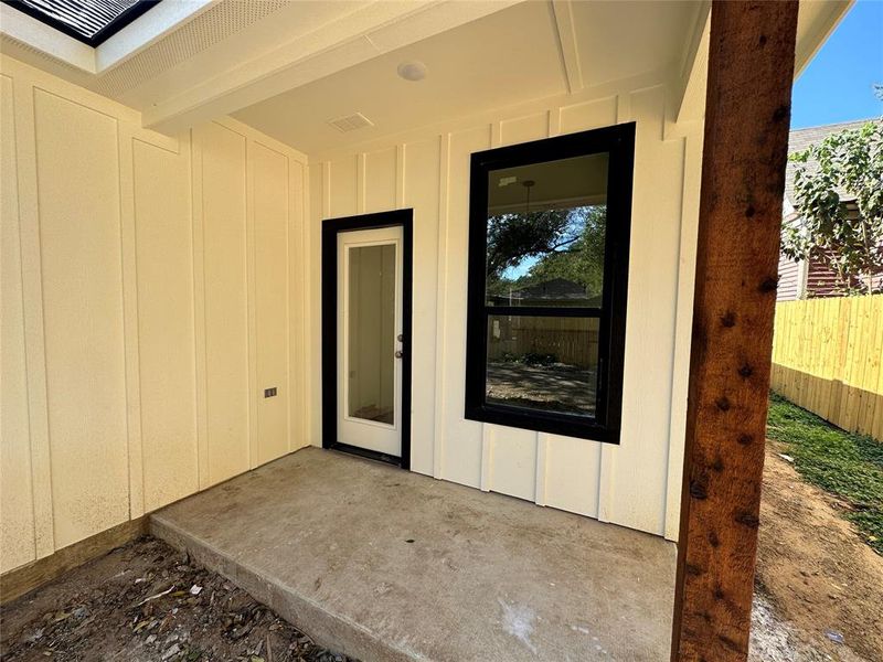 Property entrance with a patio