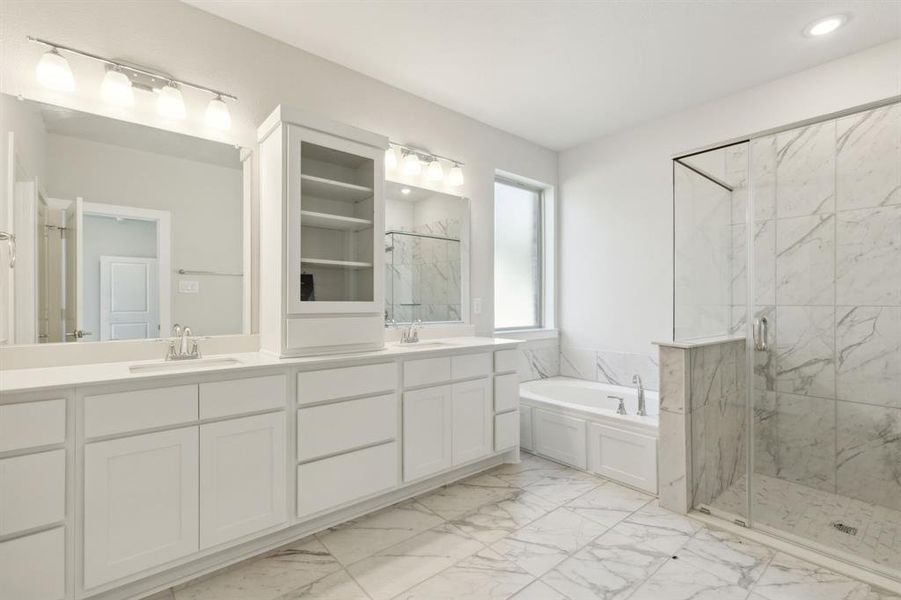 Bathroom with shower with separate bathtub and vanity