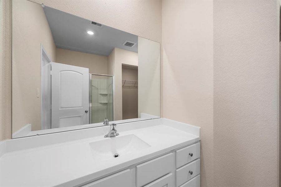 Primary Bathroom includes a spacious walk in shower.