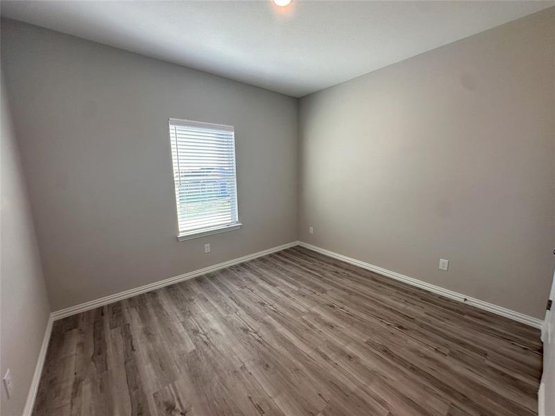 Unfurnished room with hardwood / wood-style floors