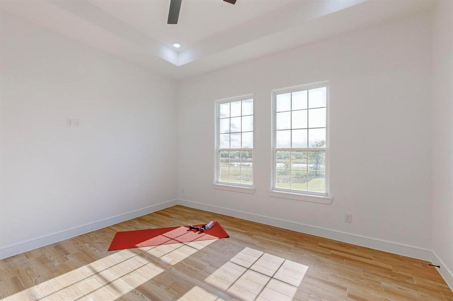 Spare room featuring light hardwood / wood-style floors and ceiling fan