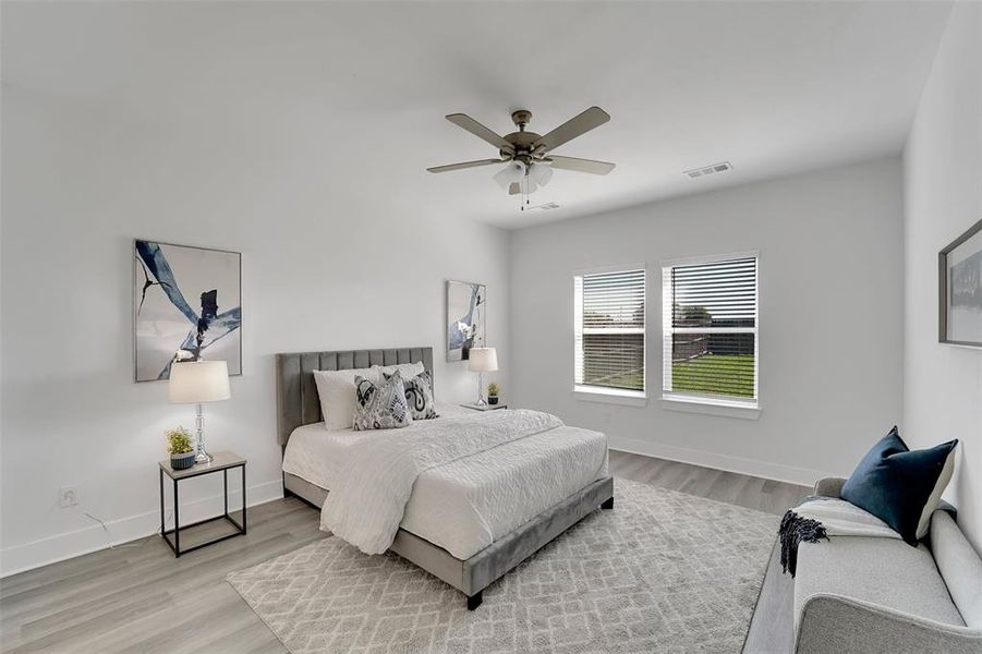 Bedroom with light wood-type flooring and ceiling fan