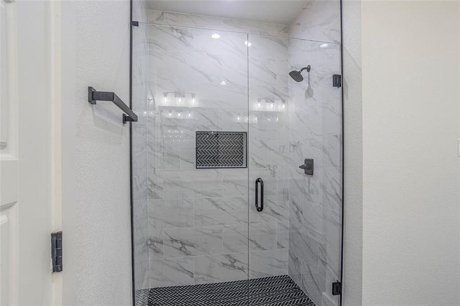 Bathroom with a shower with door