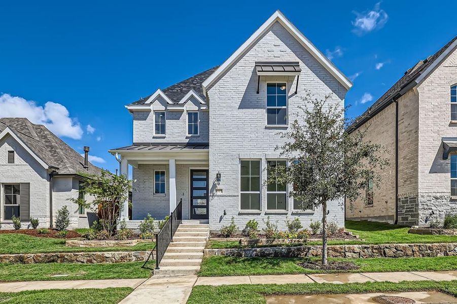 View of front of property with a front yard