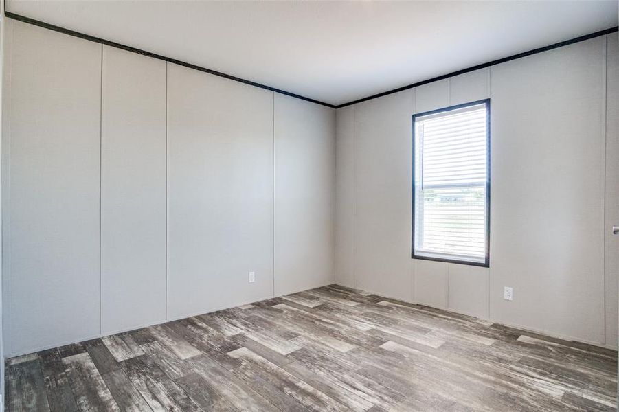 Spare room with hardwood / wood-style flooring