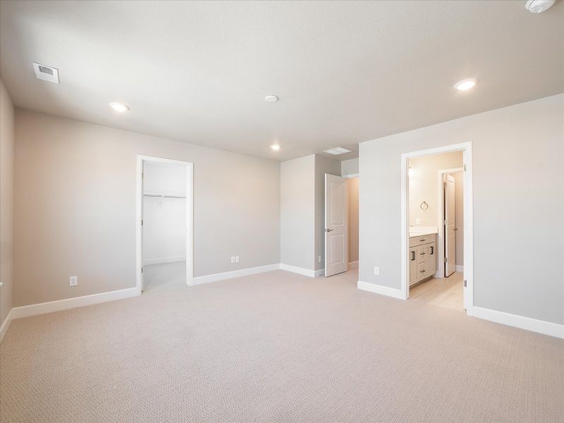 A primary bedroom perfect for unwinding after a long day.