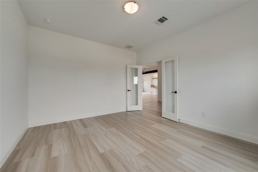 Unfurnished room featuring light wood-type flooring