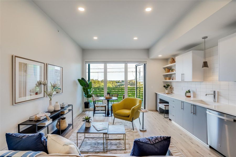 Open floor plan with floor to ceiling windows allowing the natural light to flood through the space.