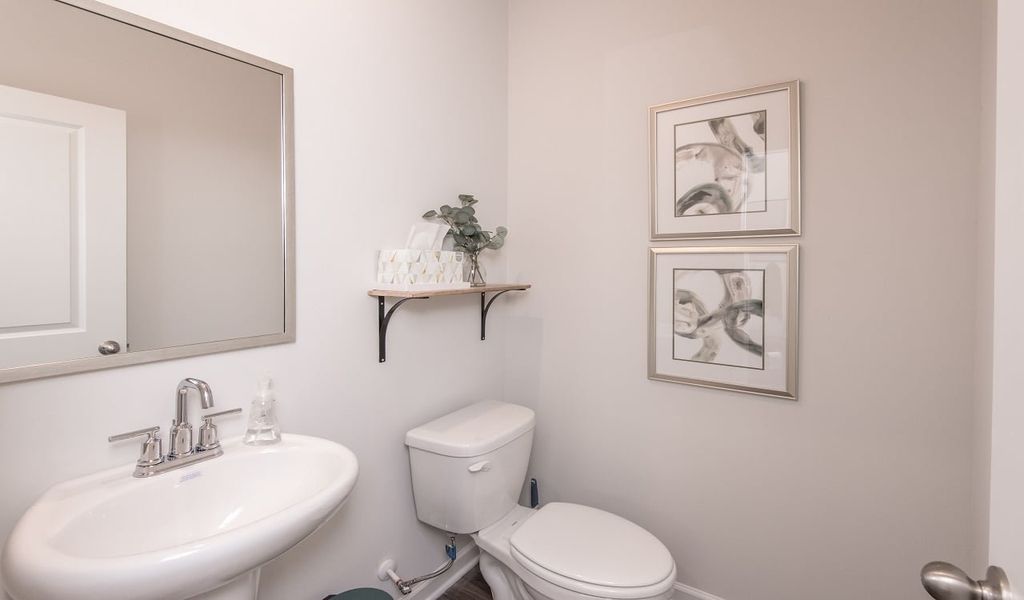 The convenient powder room is located off the great room.