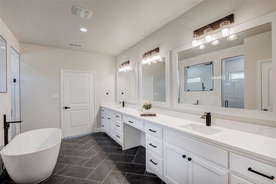 Bathroom featuring double vanity, tile patterned flooring, and GORGEOUS oversized shower and bath
