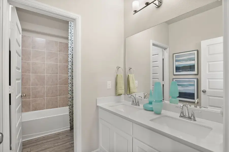 Bathroom in the Masters home plan by Trophy Signature Homes – REPRESENTATIVE PHOTO