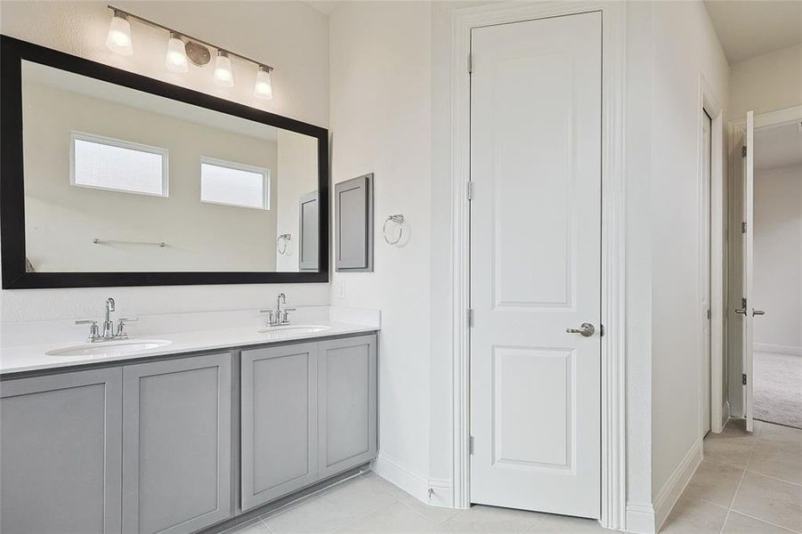 Bathroom with vanity and tile patterned floors