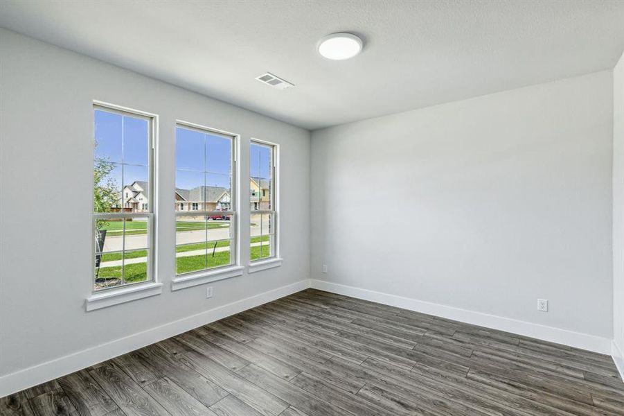 Unfurnished room with dark hardwood / wood-style floors