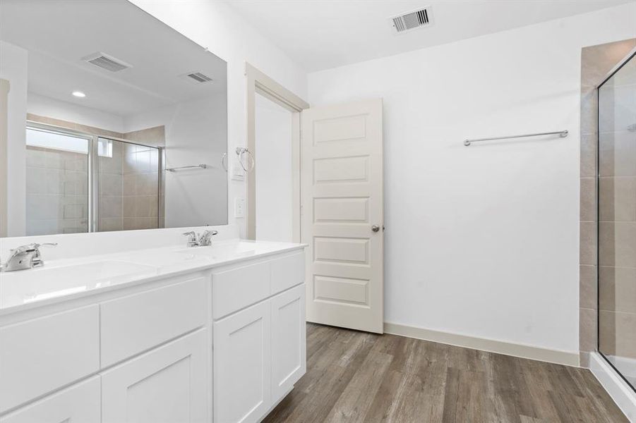 The Primary Suite Bathroom was made for Two! His and Her Private sink vanity, beautiful Shaker Cabinets and more! **Image Representative of Plan Only and May Vary as Built**