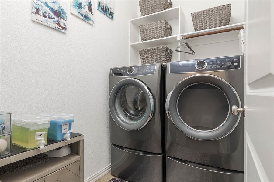 Washroom featuring independent washer and dryer