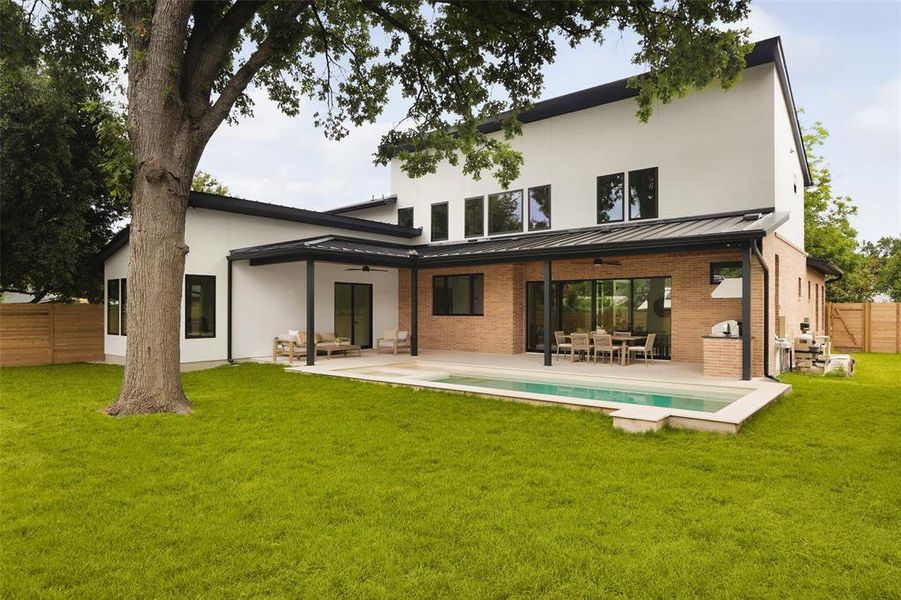 The property is graced by two large pecan trees; one casting leafy shade over the sleek, limestone-surrounded pool and spa.