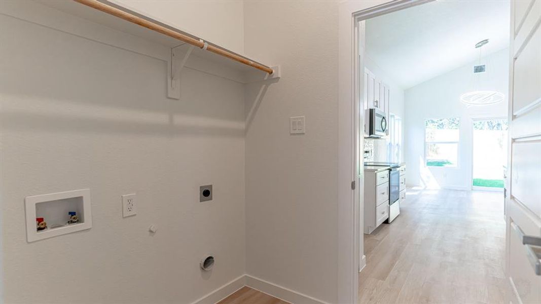 Utility room with entry to kitchen