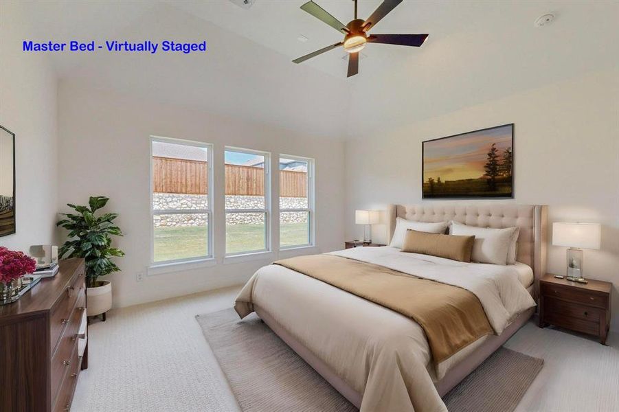 Bedroom featuring light carpet, ceiling fan, and a high ceiling