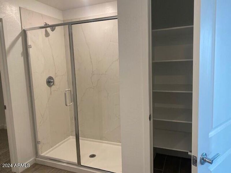 Primary shower and linen closet