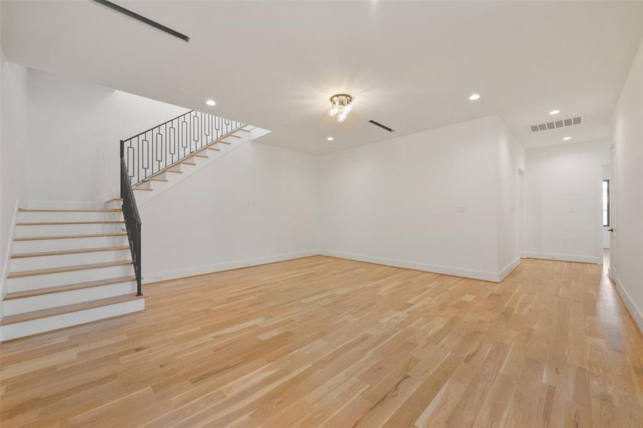 Another view of the game room area accessed from the main hallway. These stairs lead to the third floor also accessible by the  the elevator which is located down the hallway on the right.