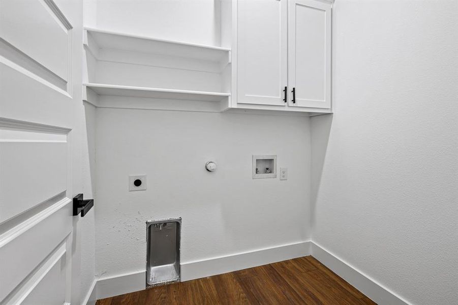 Clothes washing area with cabinets, washer hookup, dark hardwood / wood-style floors, hookup for a gas dryer, and hookup for an electric dryer