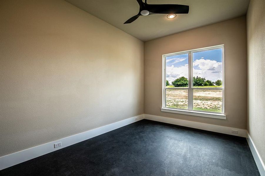 Gym with padded floor mats. Mats can be removed and turned into an office