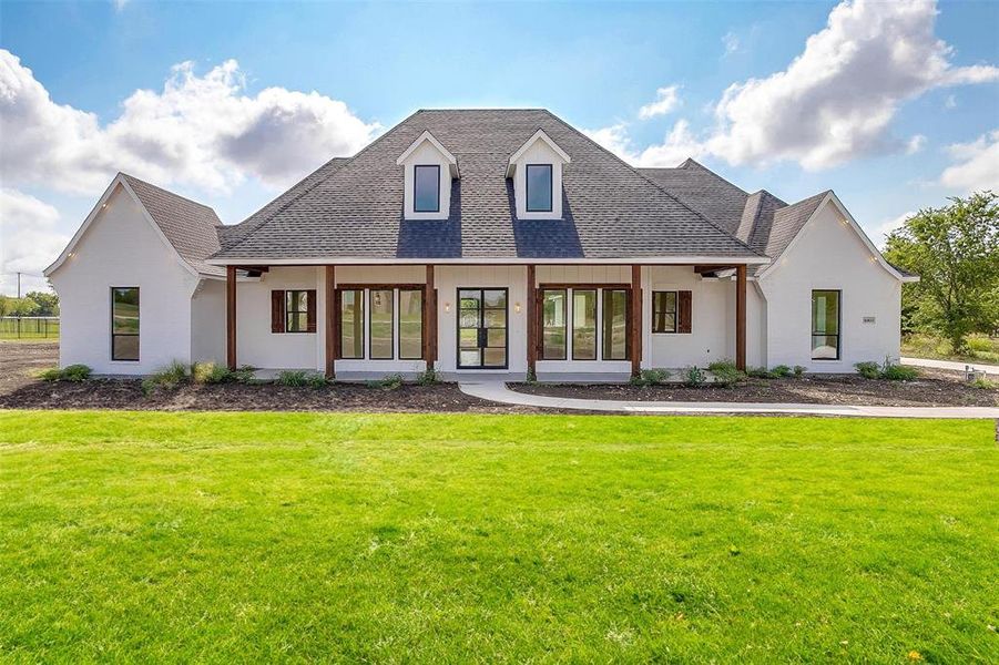 View of front of house featuring a front lawn