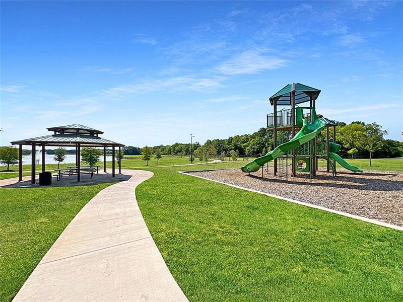 View of play area with a yard and a gazebo