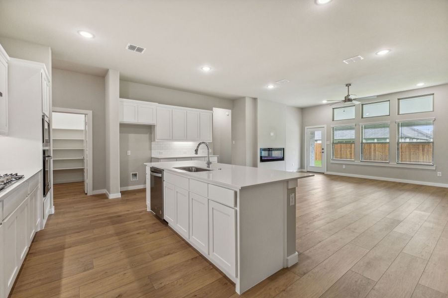 Kitchen in the Daltrey home plan by Trophy Signature Homes – REPRESENTATIVE PHOTO