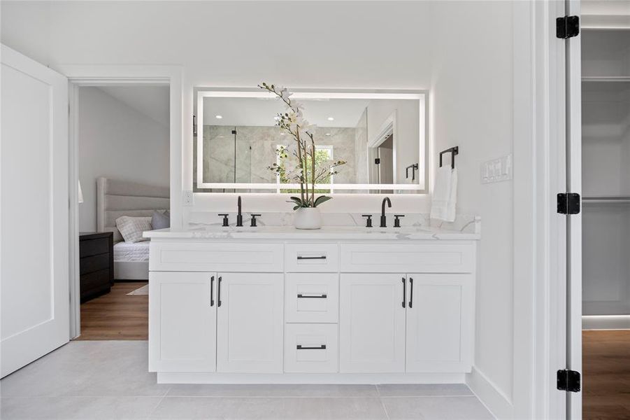 Bathroom featuring double vanity and hardwood / wood-style flooring