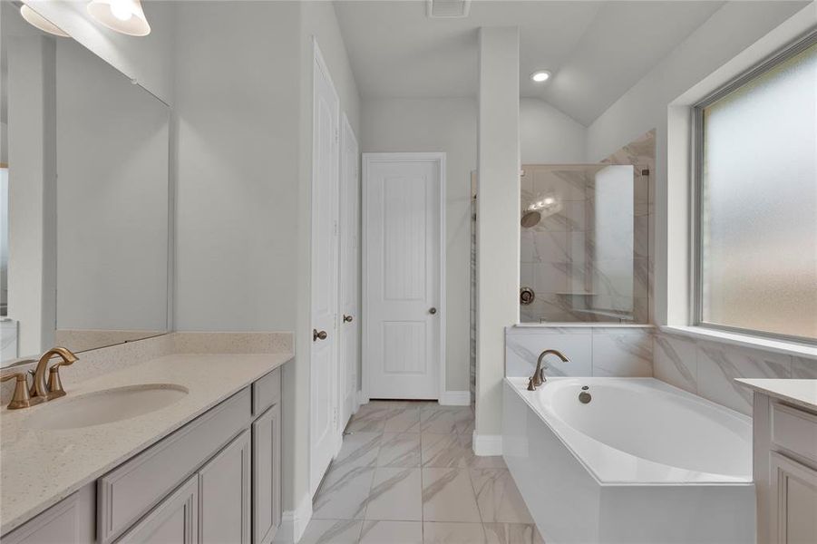 Soaking tub and separate shower, with large walk-in closet