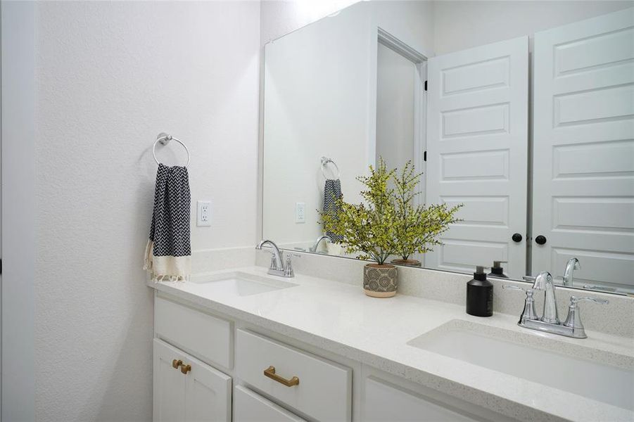 A full bathroom with a double vanity