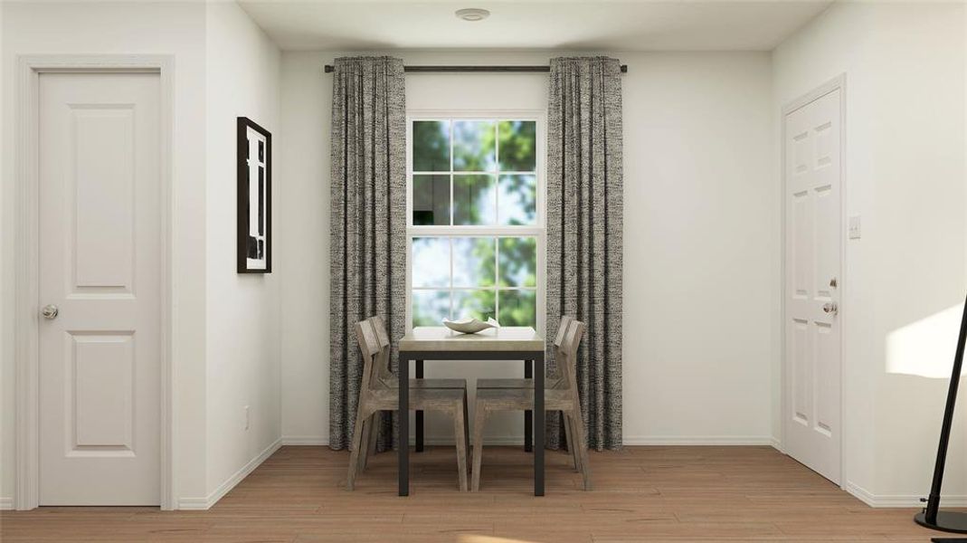 Dining space with light hardwood / wood-style flooring