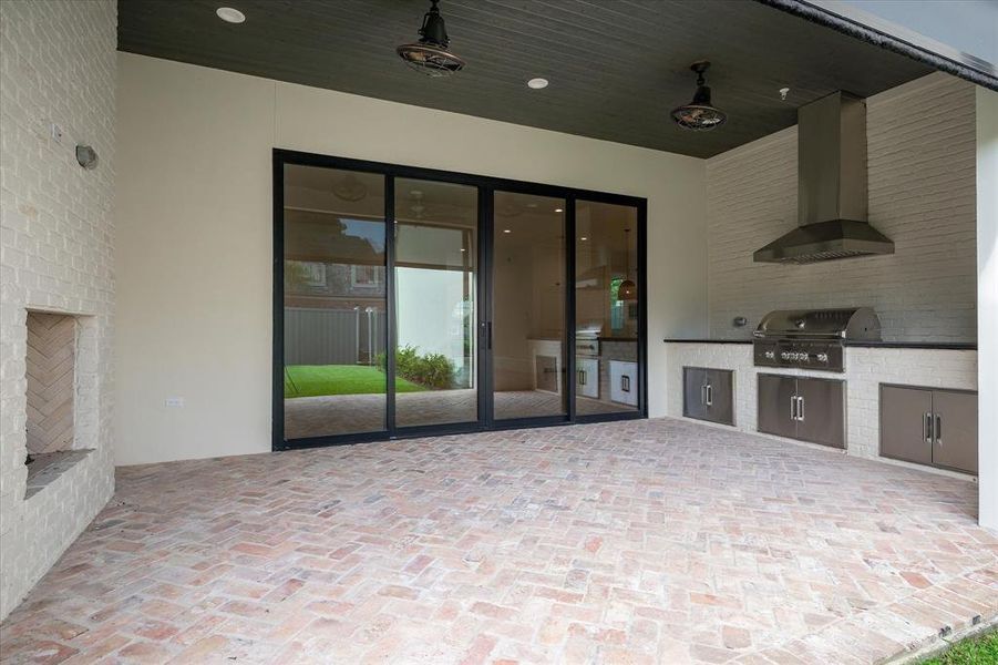 View of patio featuring grilling area and an outdoor kitchen