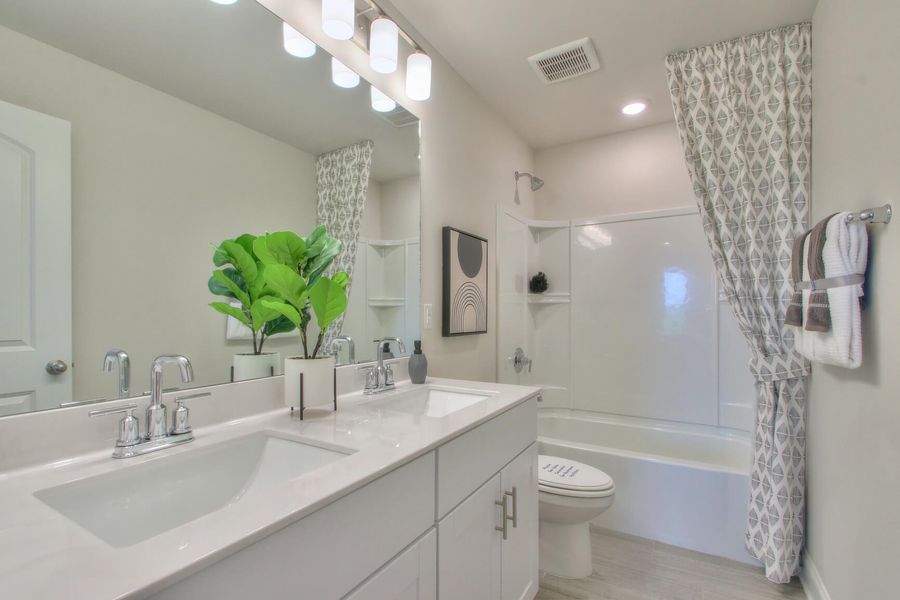 The secondary bath offers a space for guests to get ready. Photography from Skyridge in Nashville.